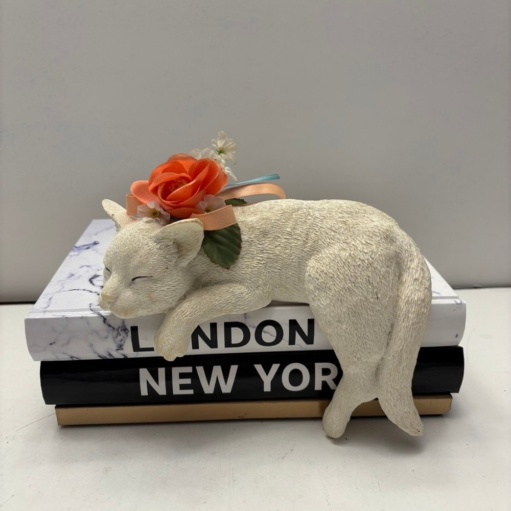 Ceramic lazy sleeping white cat with orange flower decor